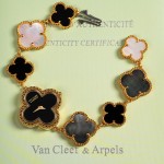 Van Cleef & Arpels Alhambra watch with black and white mother-of-pearl clover motifs and a black dial.